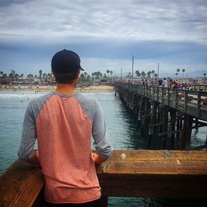 Man standing on pier
