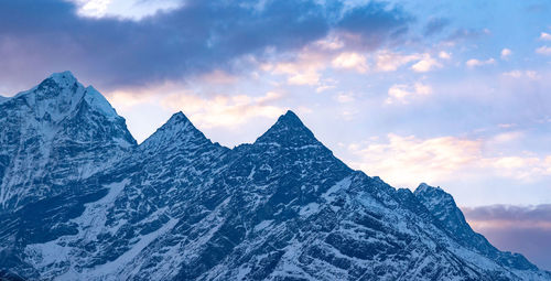 Panoramic view of snowcapped mountains against sky