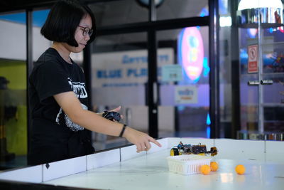 Girl playing game at table