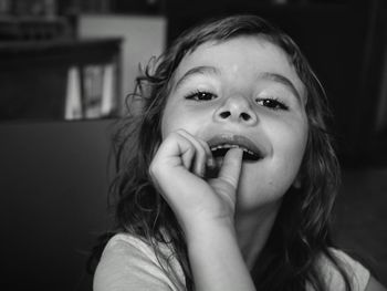 Portrait of boy eating food at home