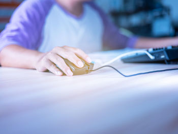 Midsection of woman using mobile phone