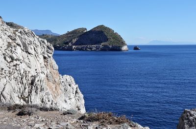 Scenic view of sea against clear blue sky