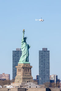 Low angle view of statue against clear sky