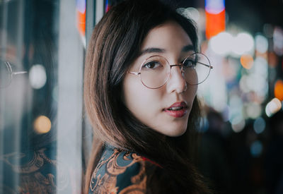 Close-up portrait of young woman looking away