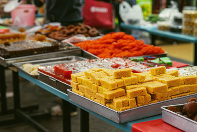 Indian assorted sweets or mithai for sale during deepavali or diwali festival at the market.