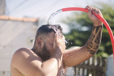 Portrait of shirtless man in water