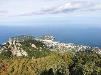 Scenic view of sea and landscape against sky