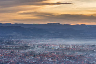 High angle view of townscape against sky during sunset