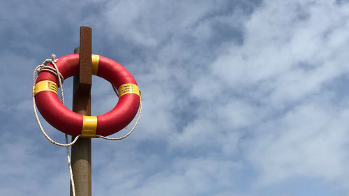 Low angle view of metal pole against sky