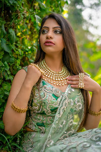 Young woman wearing traditional clothing while looking away