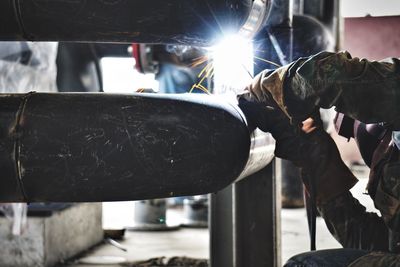 Man welding metal at workshop