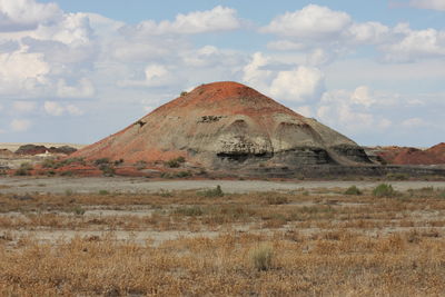 Built structure on landscape against sky