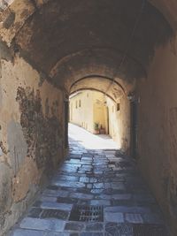 Empty alley amidst buildings