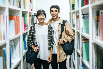 Young couple looking at book