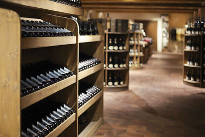 Row of wine bottles on shelf