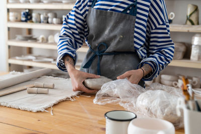 Midsection of man working at table