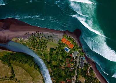 High angle view of buildings by sea