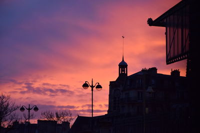 Low angle view of building at sunset