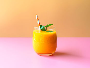 Close-up of mango drink in glass