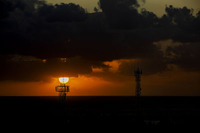 Sunset over the ocean in the village of albion, mauritius.