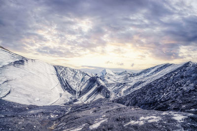 Scenic view of snowcapped mountains against sky