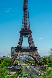 Eiffel tower in city against sky