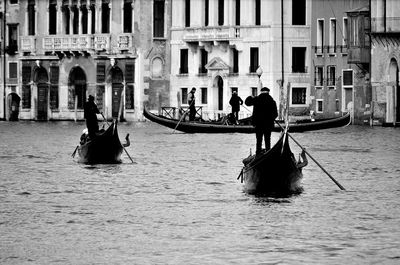 Men in boat on canal