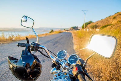 Motorcycle on road against sky