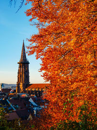 Low angle view of clock tower during autumn