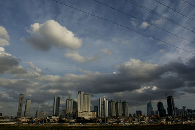 Low angle view of cityscape against sky