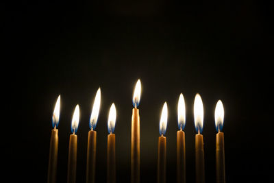 Close-up of burning golden hanukah candles