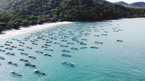 High angle view of people on sea shore