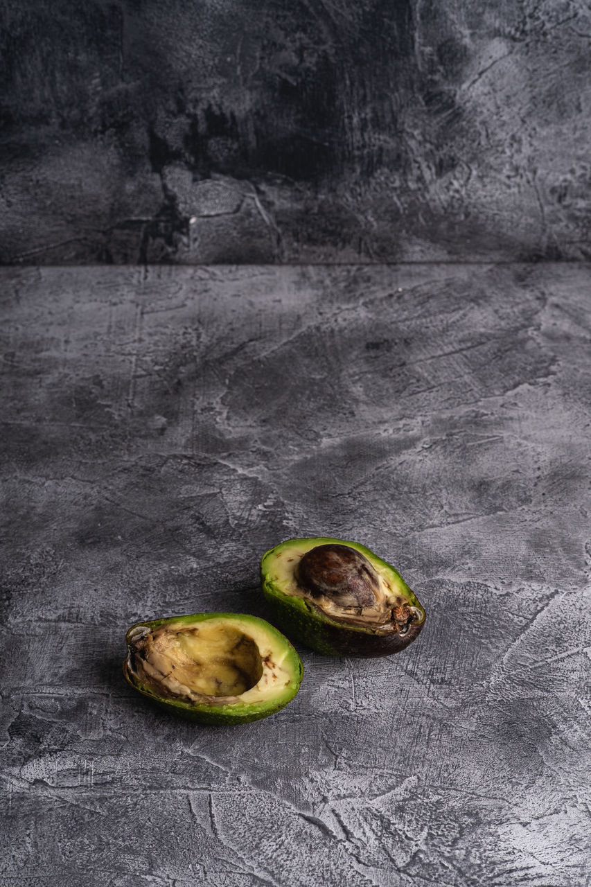 CLOSE-UP OF FRUITS ON TABLE AGAINST WHITE BACKGROUND