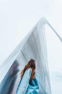 Low angle view of woman against sky