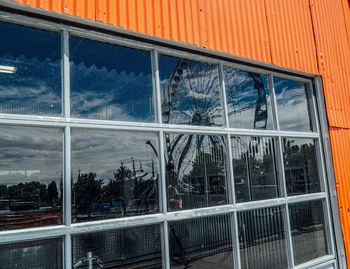 Reflection of building on glass window