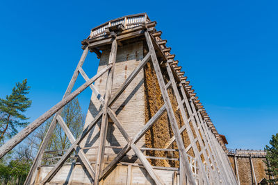 Low angle view of tower against clear blue sky