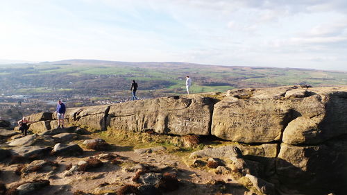 Rear view of man standing on mountain