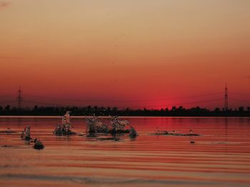 Scenic view of sea against clear sky during sunset