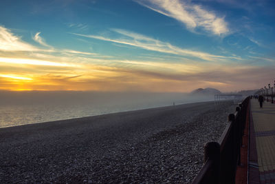 Scenic view of beach against sky during sunset