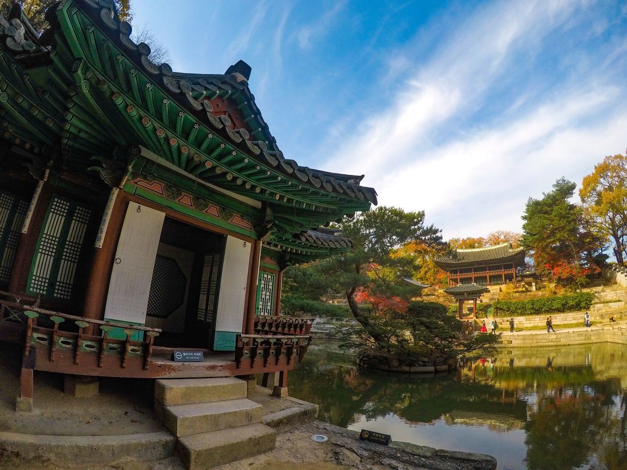 TEMPLE BY TREES AGAINST SKY