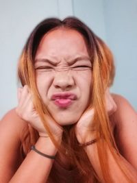 Close-up portrait of a serious young woman