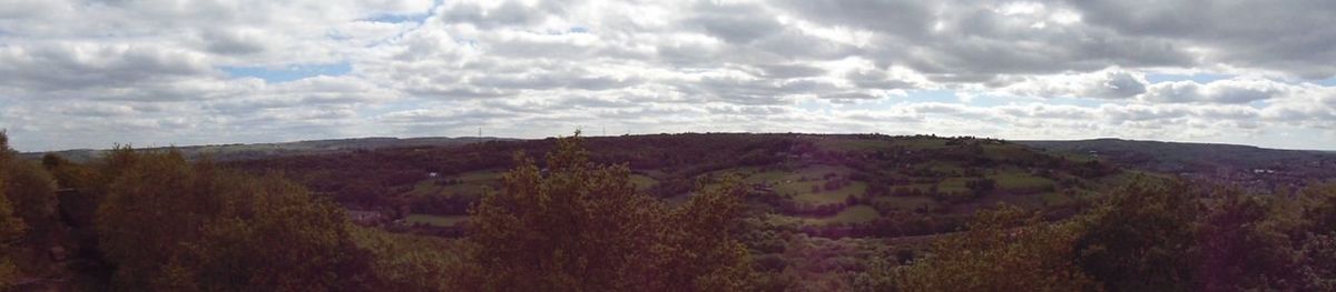 Scenic view of landscape against cloudy sky