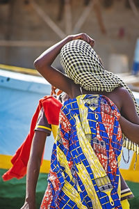 Rear view of women standing outdoors