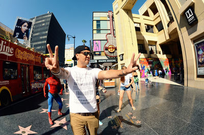 People standing on street in city