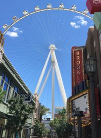 Low angle view of ferris wheel against sky