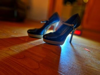 High angle view of shoes on hardwood floor