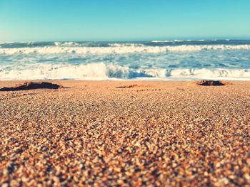 Scenic view of beach against clear sky