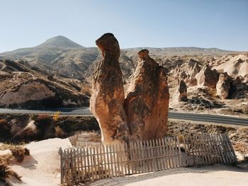 View of rock on landscape against sky