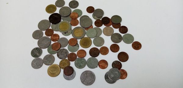 High angle view of coins on table