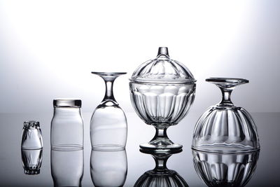 Close-up of glasses on table against white background
